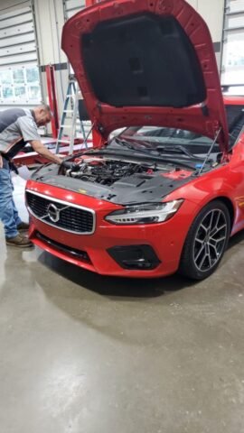 Comprehensive Diagnostic & Service on Red Volvo Sedan