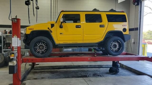 Hummer H2 on rack Project at ASX - Auto Service Xperts Warner Robins